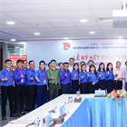 The joint agreement signing ceremony between the Youth Unions of Petrovietnam Gas Joint Stock Corporation and Nha Be District